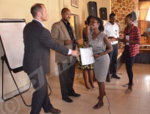 Participants in the boot camp receiving their certificates 