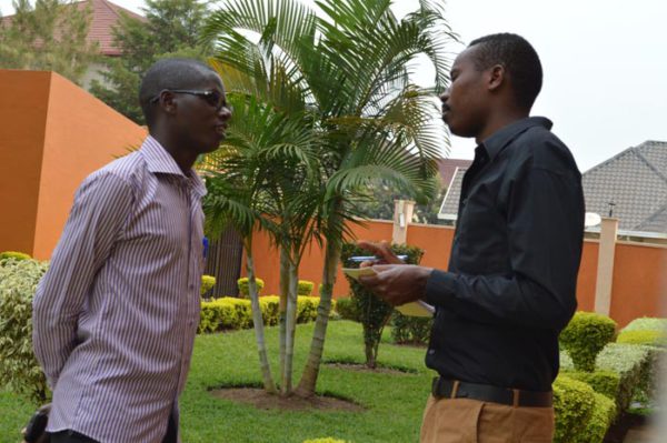 Jean Bigirimana discussing with a colleague.