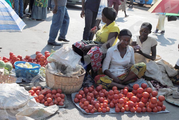 A woman selling tomatoes