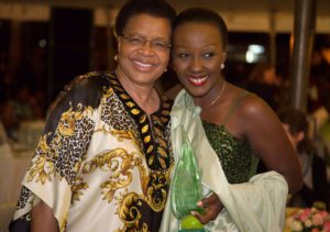 Ange Muyubira with Gracia Machel, Mandela’s wife, after receiving Segal Family Foundation Award in Uganda. 
