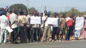 Demonstrators waving placards