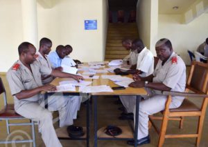 A team of lecturers from University of Burundi and ISCAM correcting copies of officer candidates