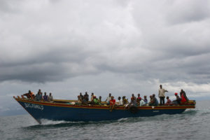 Passengers from Rumonge to Congo travel by small overloaded boats with no life jackets