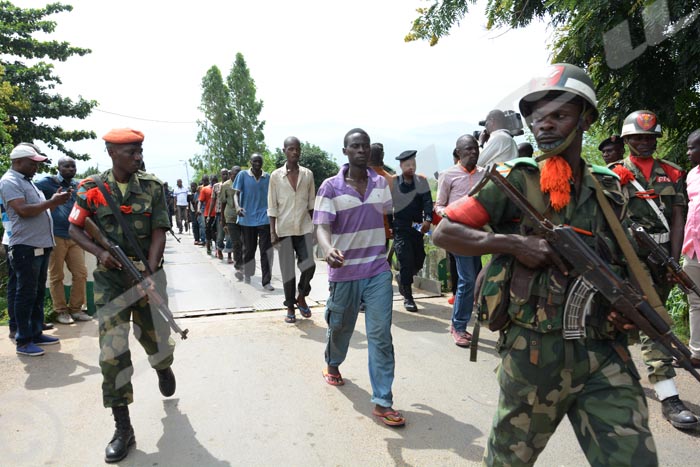 Burundian nationals escorted by the Congolese army and police