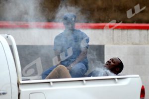 Police arresting a protester in Bujumbura 