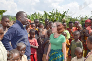 Ambassador Anne Casper in the midst of a Batwa crowd in Muhanga Commune